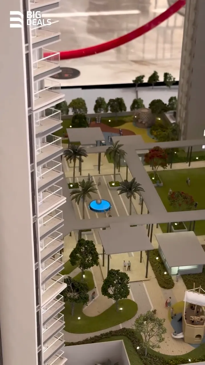 The scale model of Prestige Ocean Pearl from above: gardens and a pool between the towers