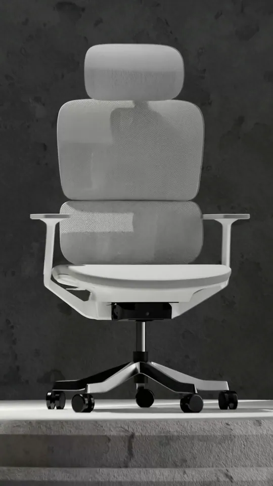 A grey mesh high-back office chair with a white frame on a stone plinth in a dark concrete room, from Bosq's 3D product film