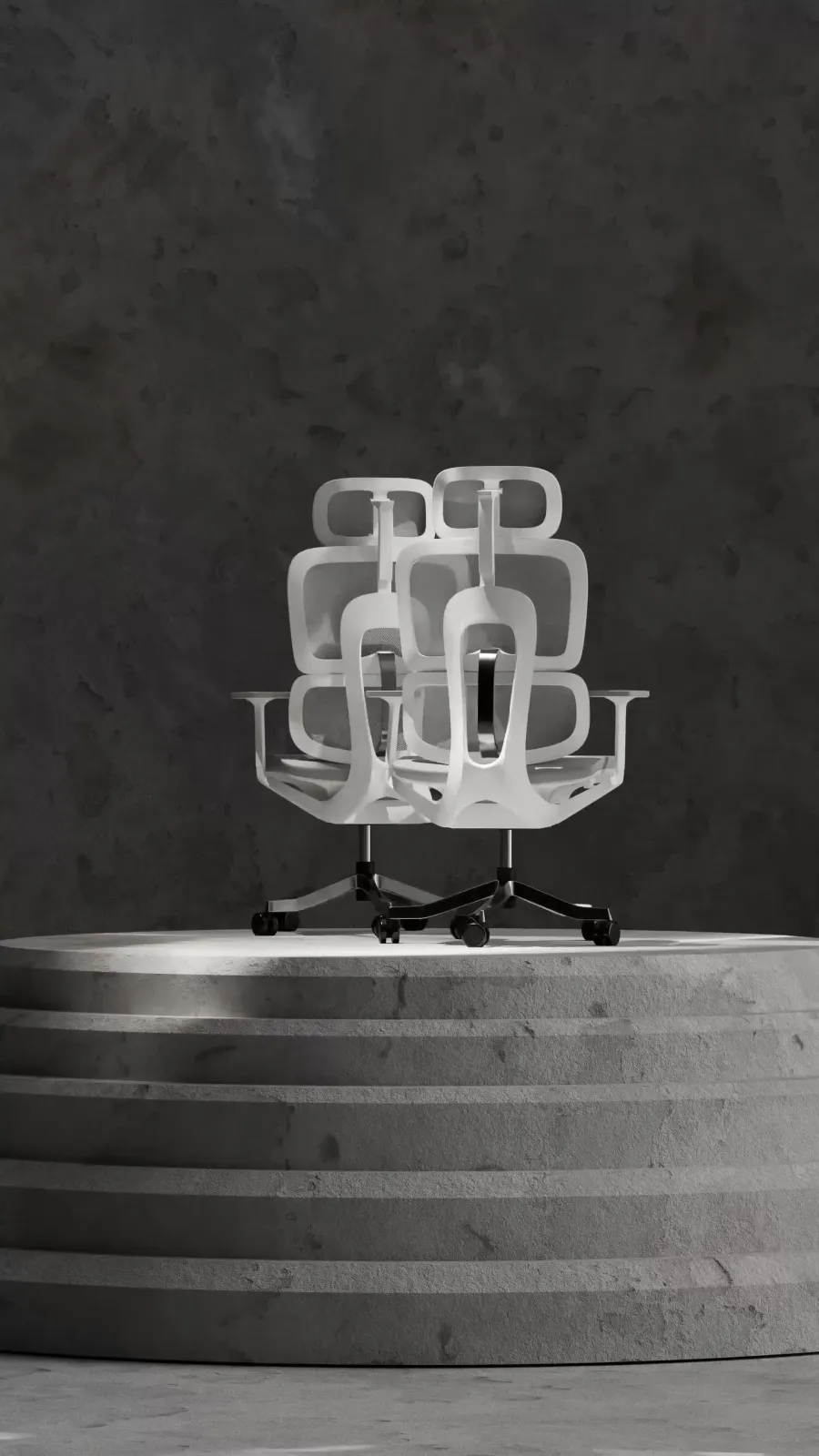 The grey mesh high-back shown from several angles at once on a stepped stone plinth