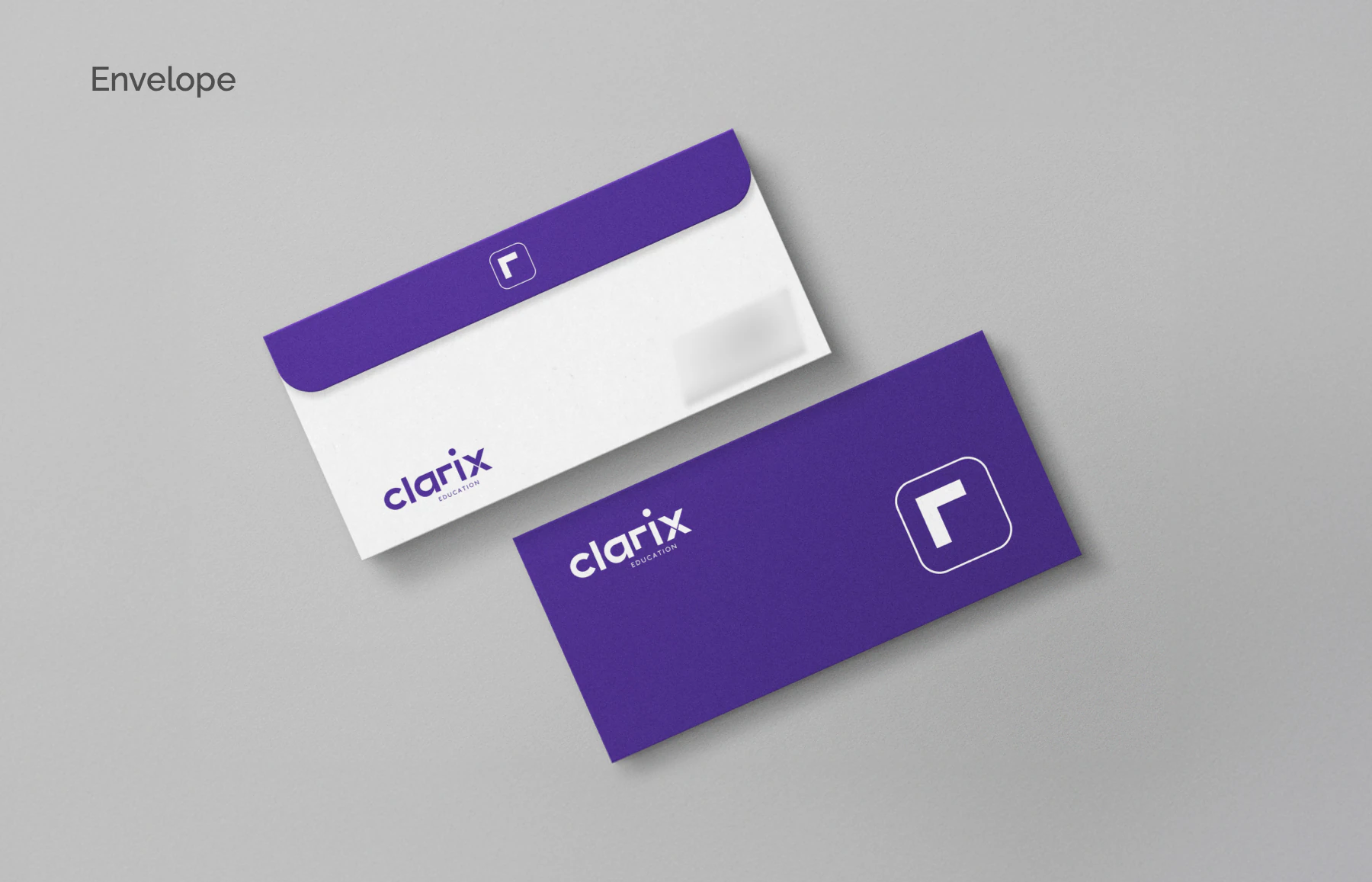 Mockup: DL envelopes, a purple flap carrying the icon and an all-purple reverse.