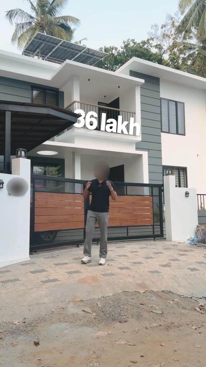 A frame from a Hiline home tour: a presenter at the gate of a white two-storey house with solar panels on the roof, under the title 36 lakh