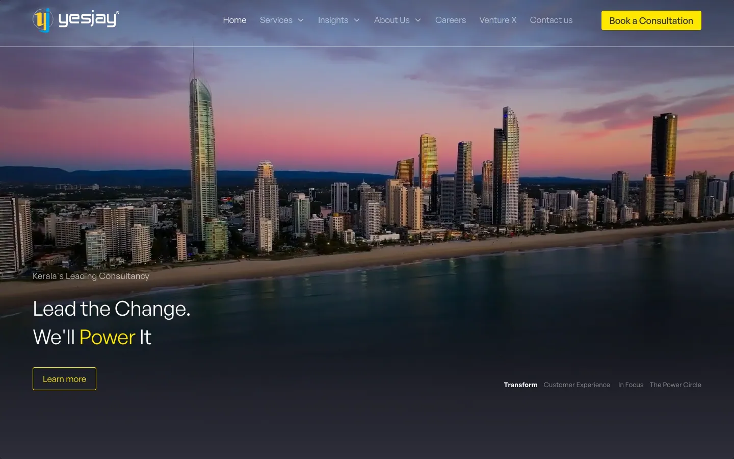 Yesjay Associates website home page: Kerala's Leading Consultancy, Lead the Change. We'll Power It, over a city skyline at dusk, with a Book a Consultation button
