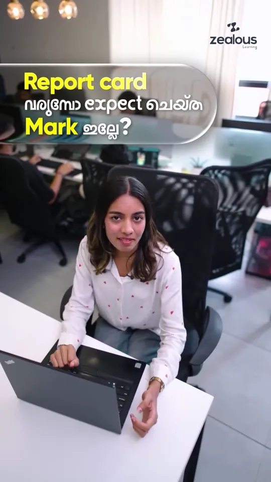 Presenter in a white shirt with red hearts at a laptop, under a caption asking in Malayalam and English whether the report card showed the mark you expected, in a Zealous Learning reel